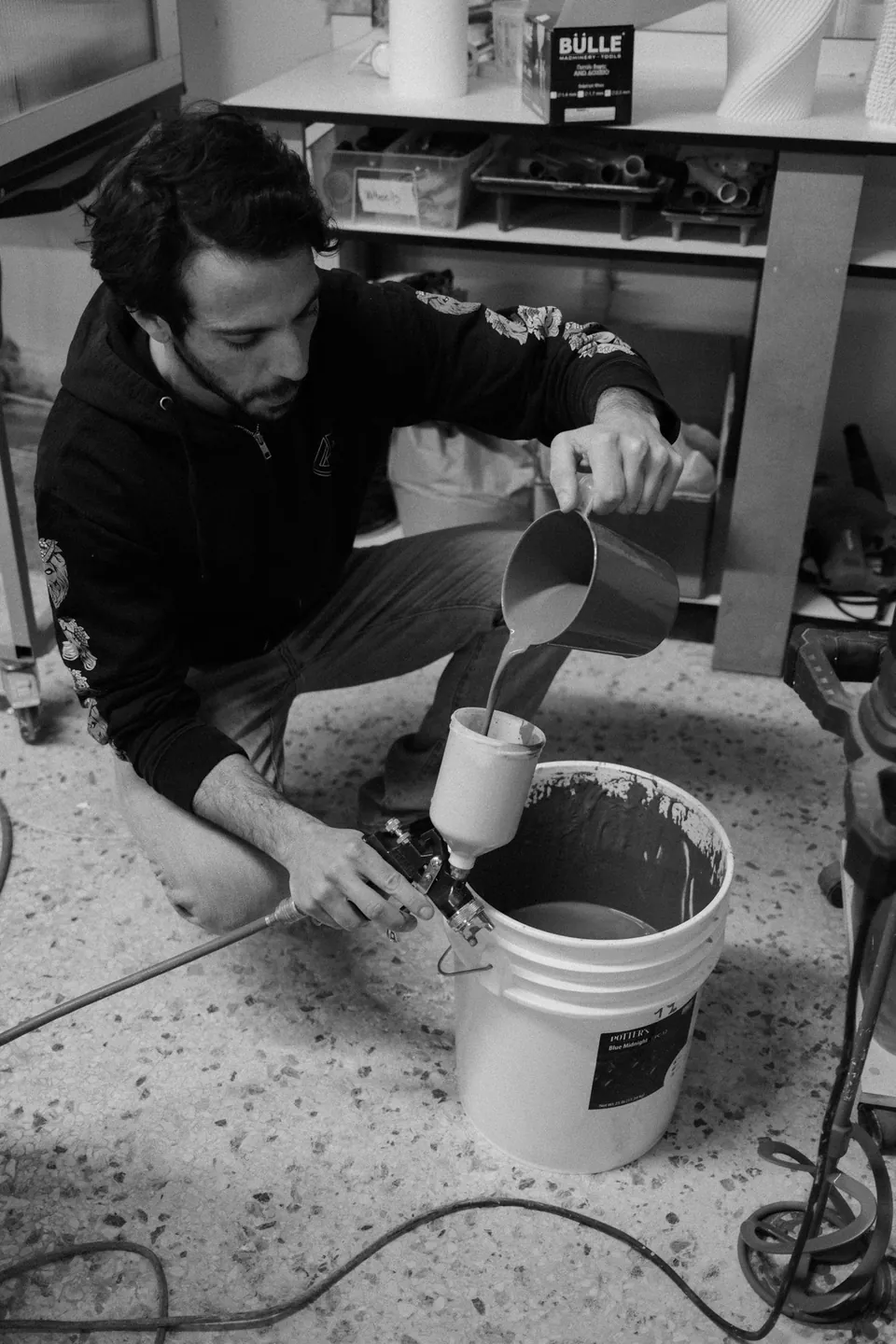 Pouring glaze into a spray gun