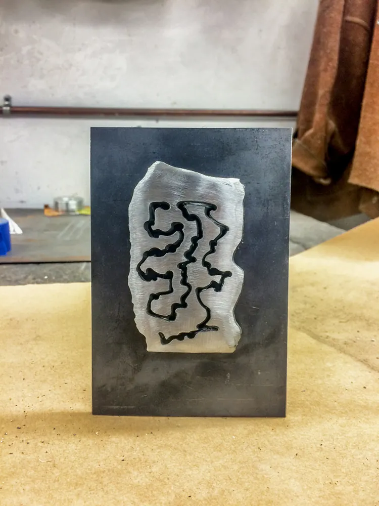 Aluminium and resin on steel