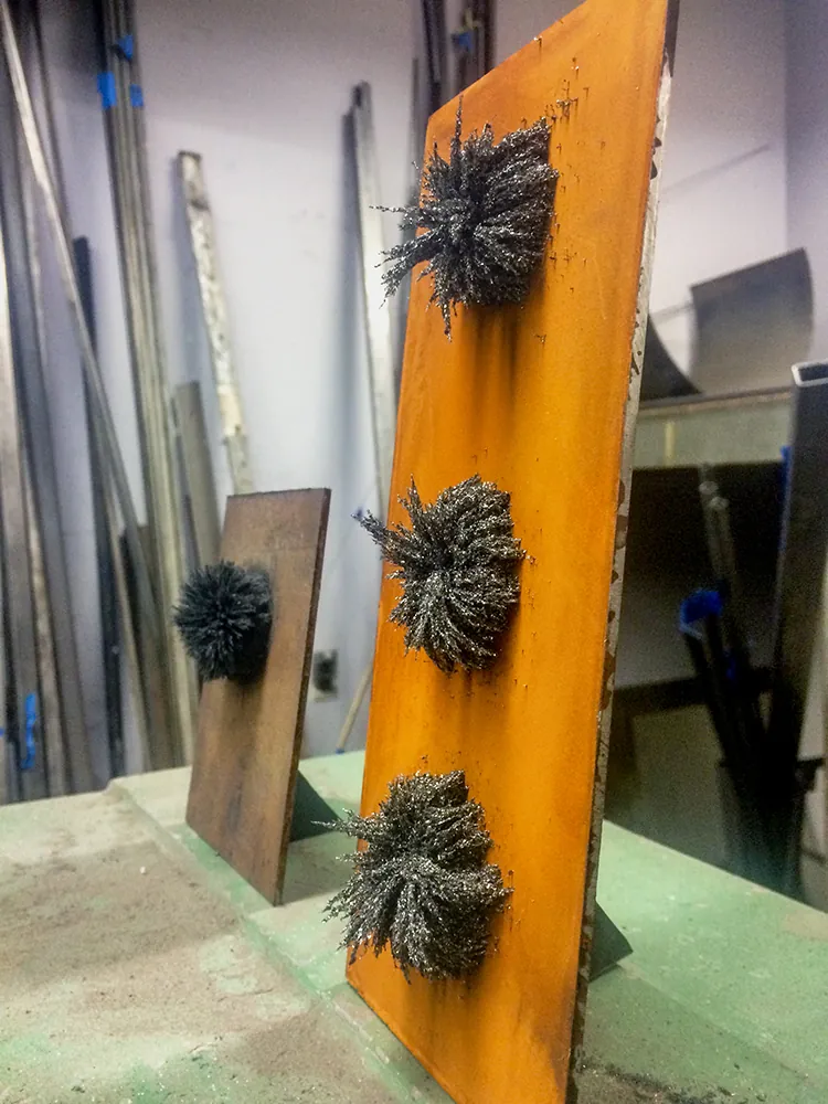 Steel wool on rusted sheet